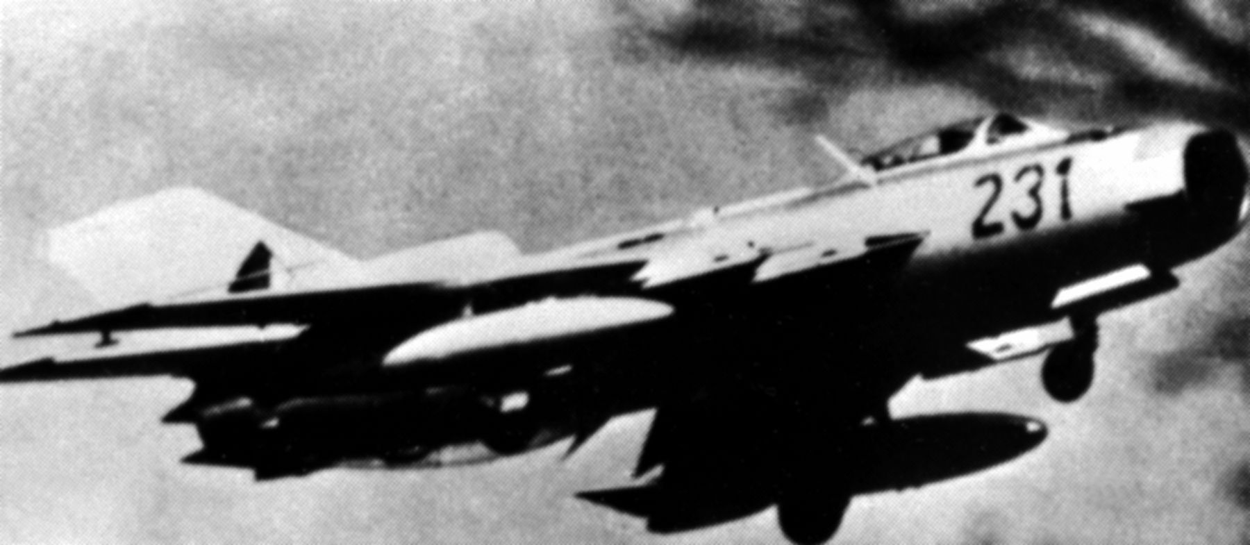 An East German MiG-19 "Farmer" fighter aircraft in flight image. Click for full size.