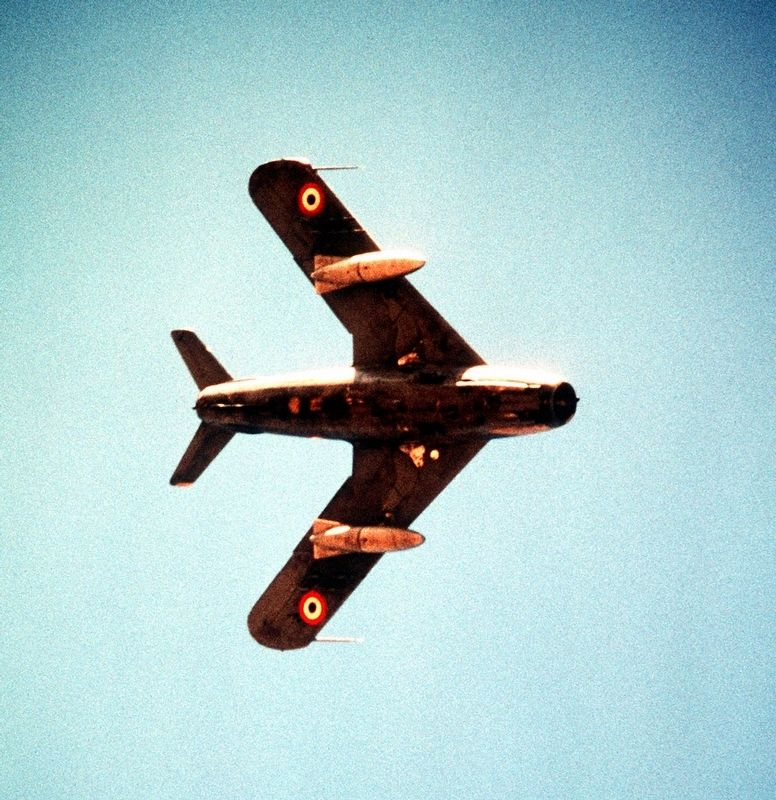 An underside view of an Egyptian (Soviet built) MiG-17F aircraft in flight image. Click for full size.