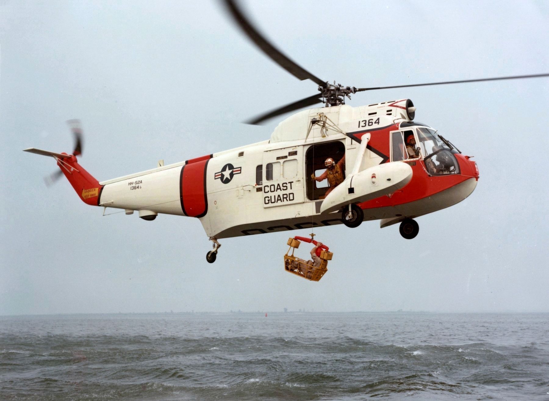 A U.S. Coast Guard Sikorsky HH-52A Seaguard with rescue basket image. Click for full size.