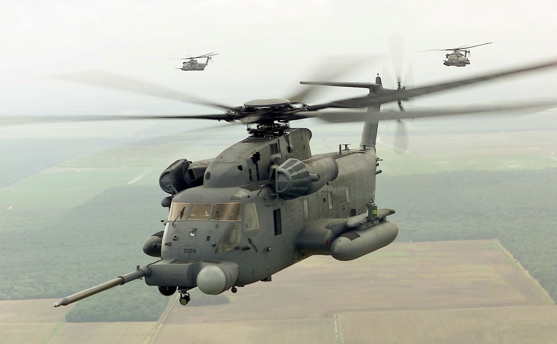 An MH-53J of the 20th Special Operations Squadron, Hurlburt Field, Fl., flies over the local area image. Click for full size.