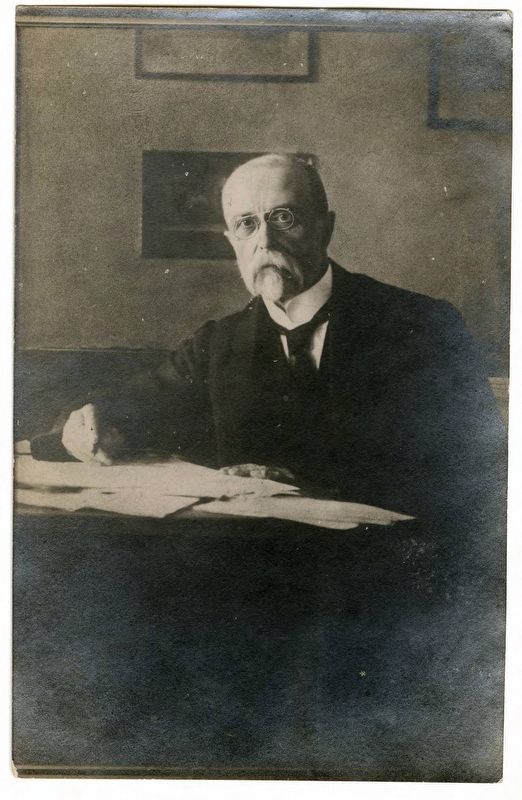 <i>Portrait of Thomas Garrigue Masaryk sitting at desk with papers</i> image. Click for full size.