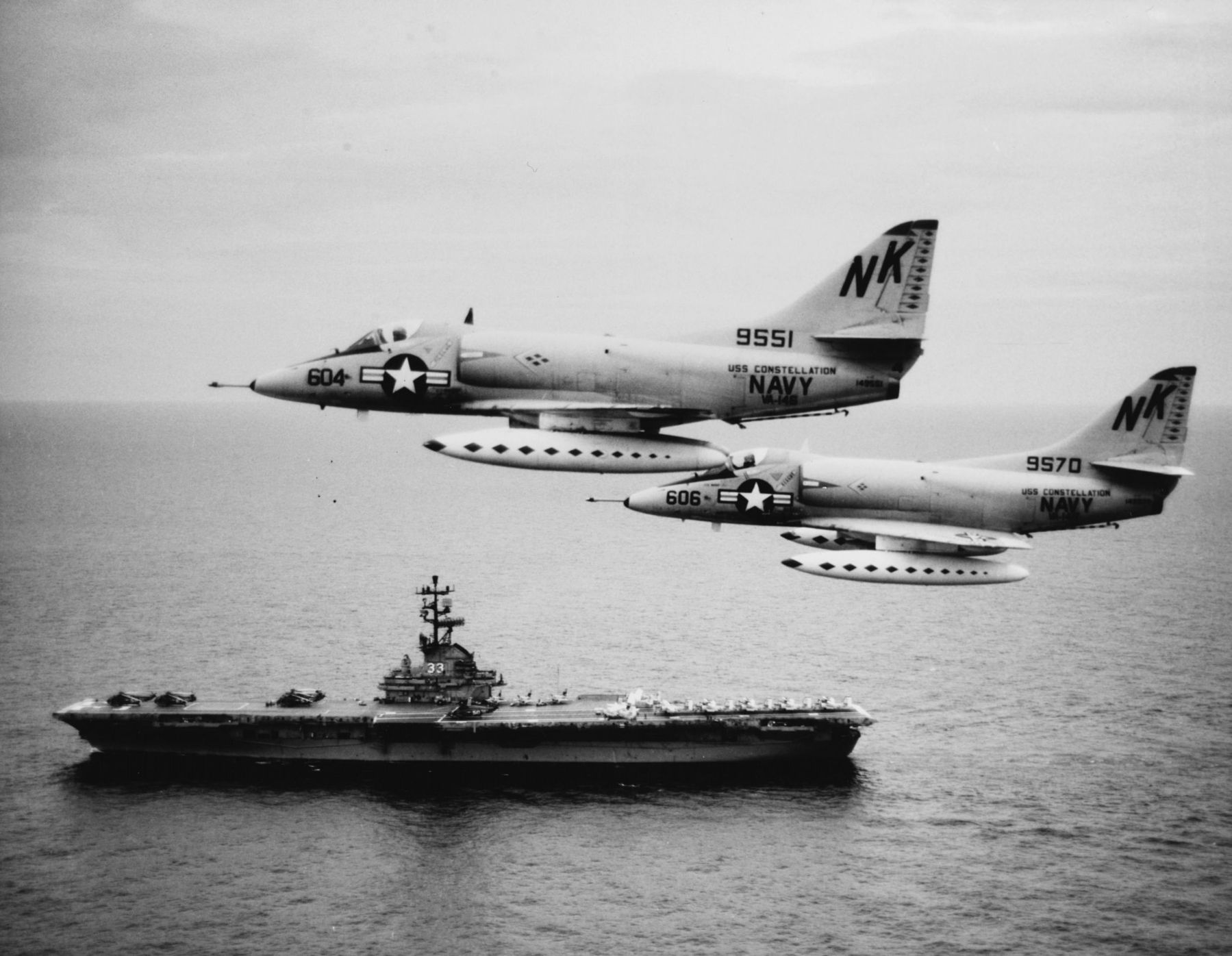 A-4Cs over the Gulf of Tonkin as USS Kearsarge steams below image. Click for full size.