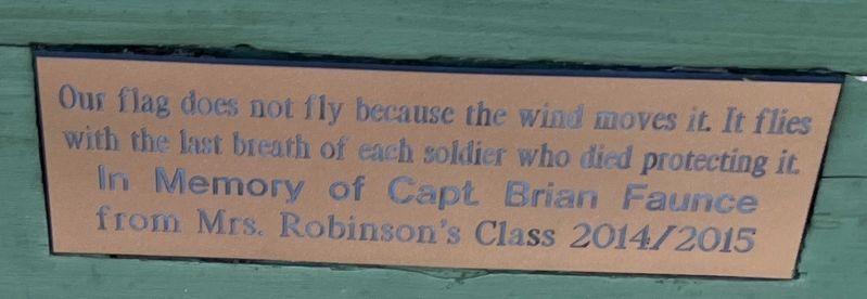 Dedication plaque on the bench left of the memorial image. Click for full size.