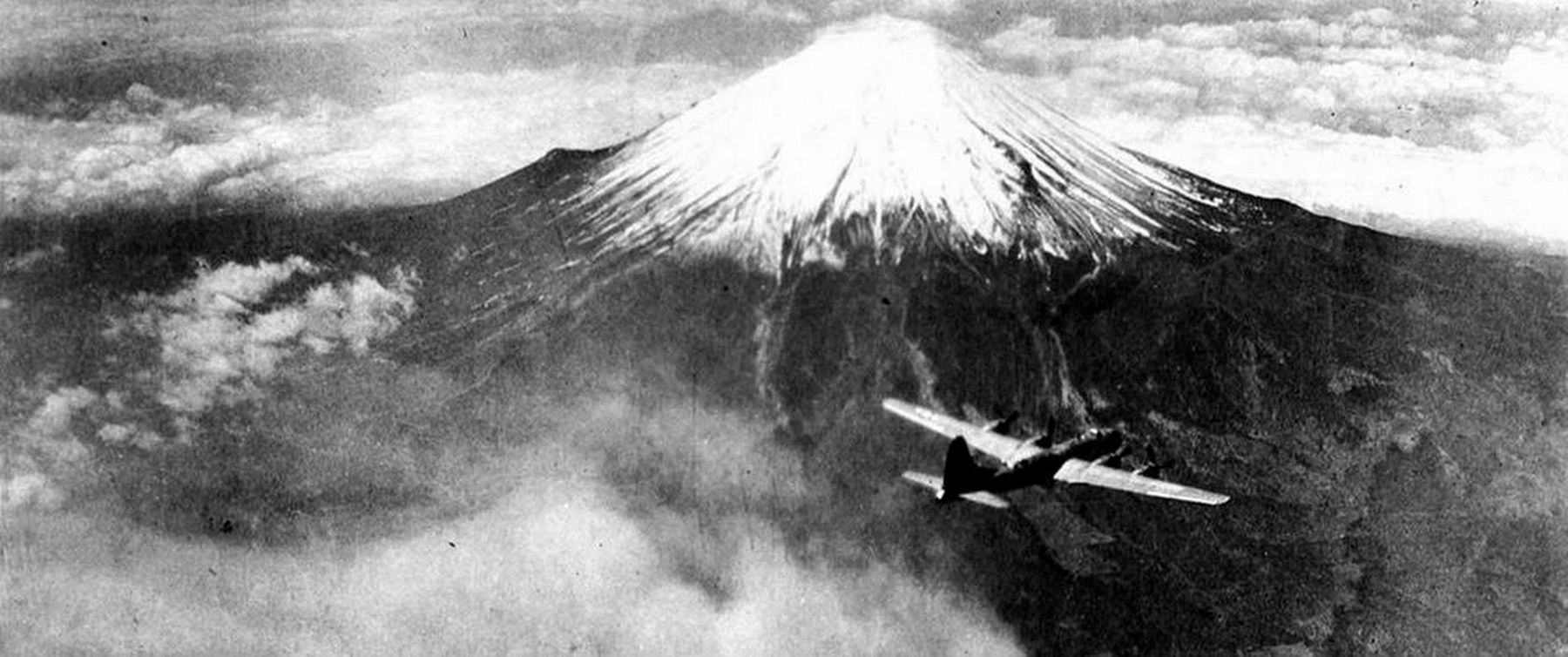 Boeing B-29 Superfortress of the 73rd Bomb Wing flies over Mt. Fuji, Japan in 1945 image. Click for full size.