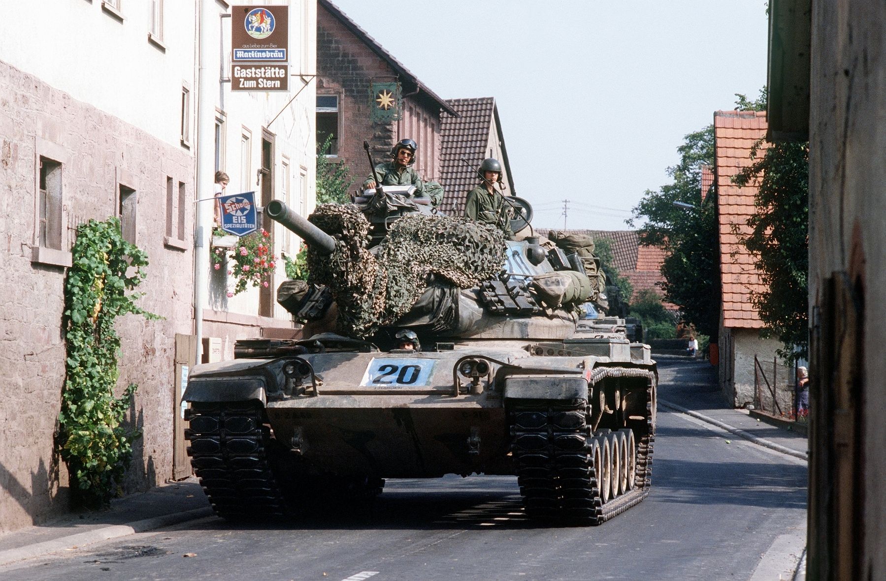 US Army M60 tank in German village image. Click for full size.