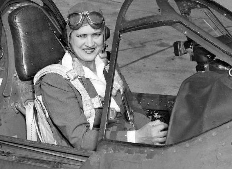 Cochran in the cockpit of a Curtiss P-40 Warhawk. image. Click for full size.