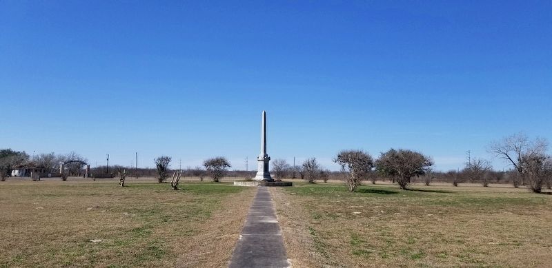 A view of the 1916 memorial obelisk in the center of the park image. Click for full size.