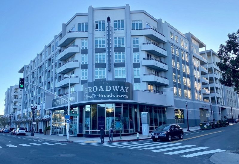 The Broadway apartments, incorporating the Connell Motor Company building facade image. Click for full size.