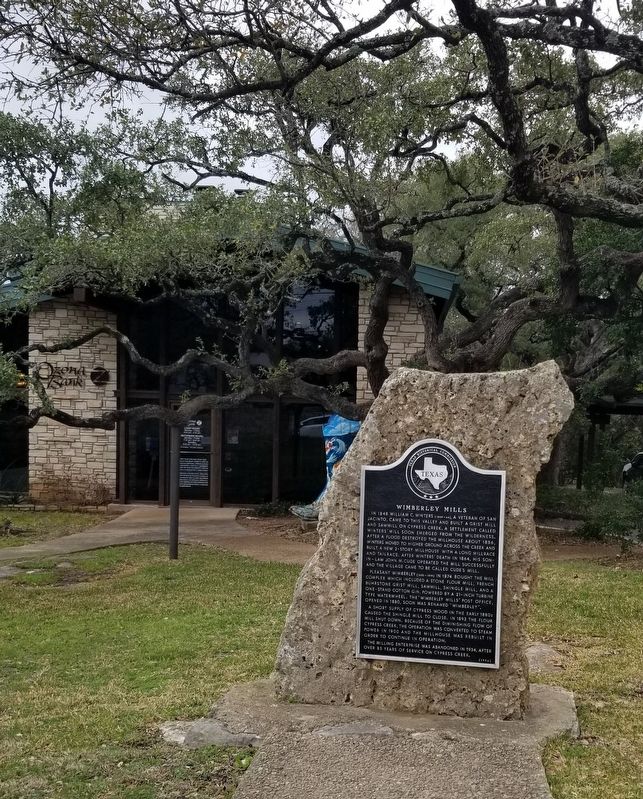 The Wimberley Mills Marker in front of the bank image. Click for full size.