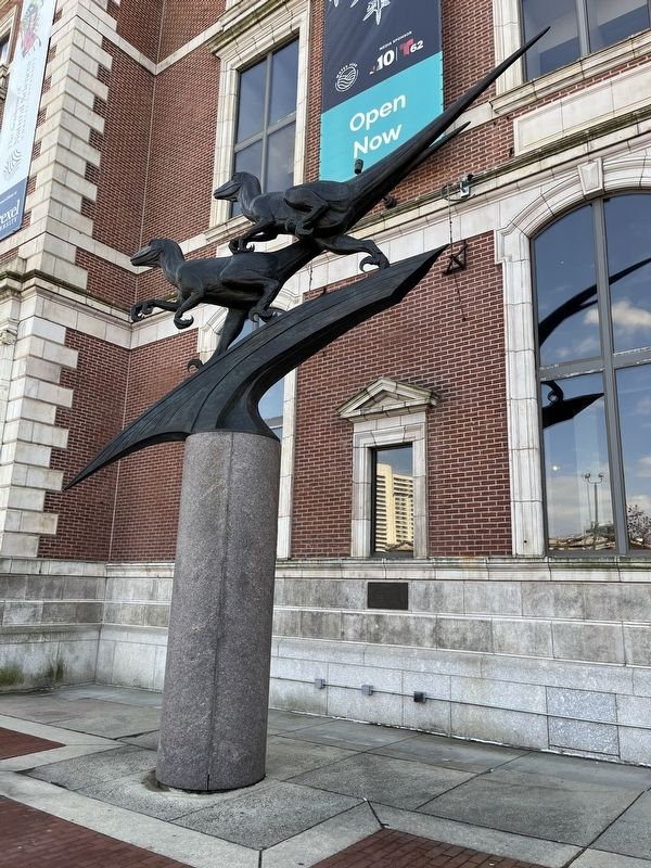 <i>Deinonychus</i> statue in front of the Academy image. Click for full size.