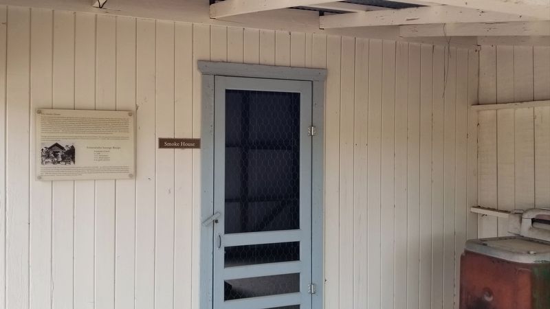 The front porch of the Smoke House and Marker image. Click for full size.