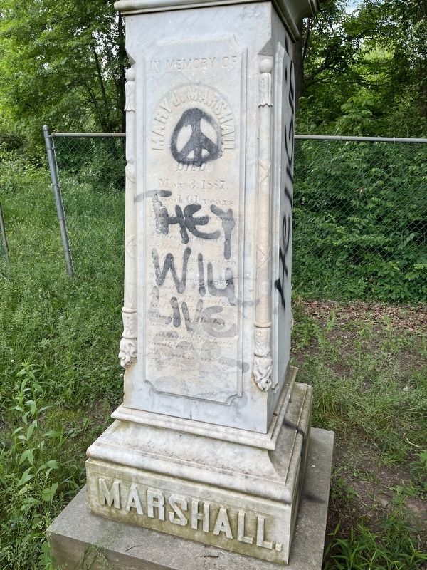 Unfortunately, the grave stone has been defaced. image. Click for full size.