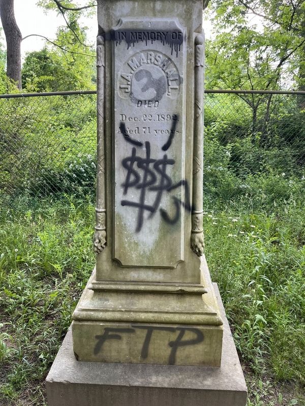 Another side of the defaced gravesite. image. Click for full size.
