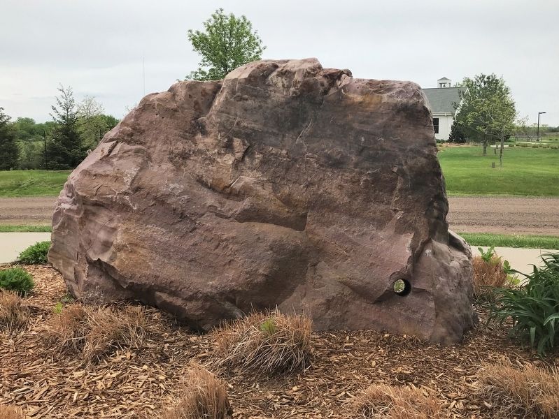 Nearby quartzite stone with a hole bored through. Click for full size. Nearby quartzite stone with a hole bored through image. Click for full size.