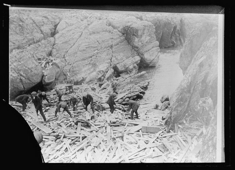 Red Cross workers search the wreckage for survivors image. Click for full size.