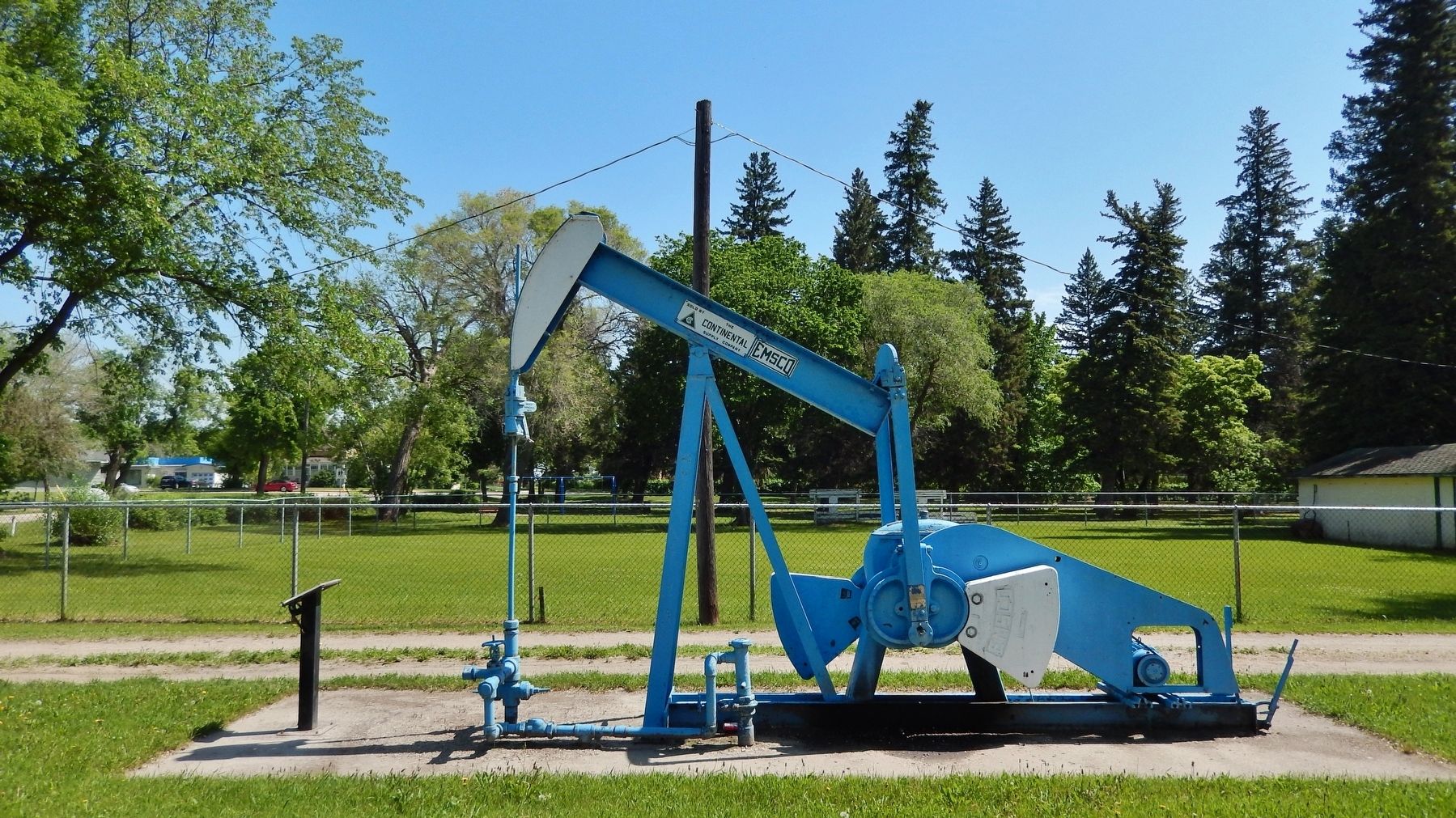 Pump Jack and Capped Well image. Click for full size.