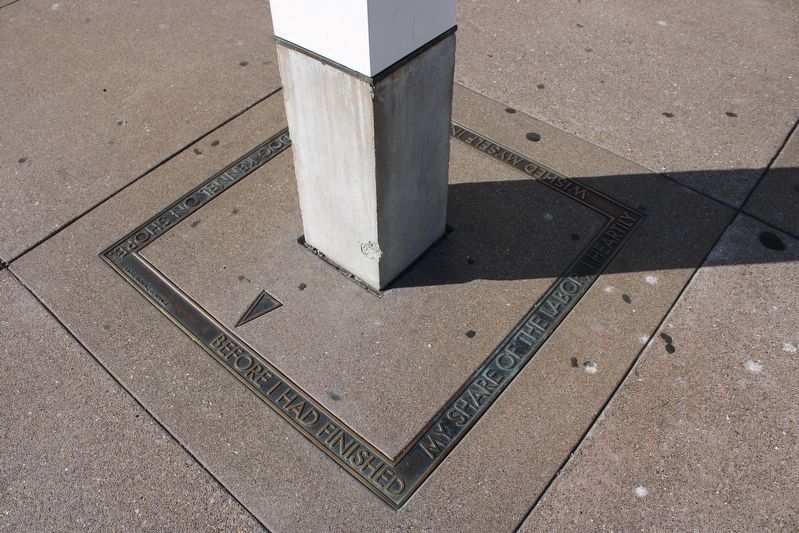 Bronze border at the base of the marker pylon, side 1 image. Click for full size.