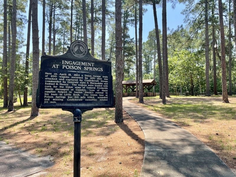 View of marker in park, towards pavilion with additional markers. image. Click for full size.