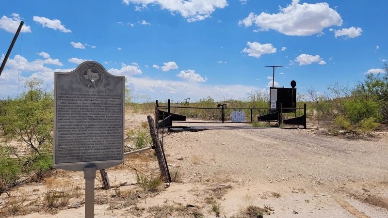 The "Weir No.1" Oil Well Marker at a roadside gate image. Click for full size.