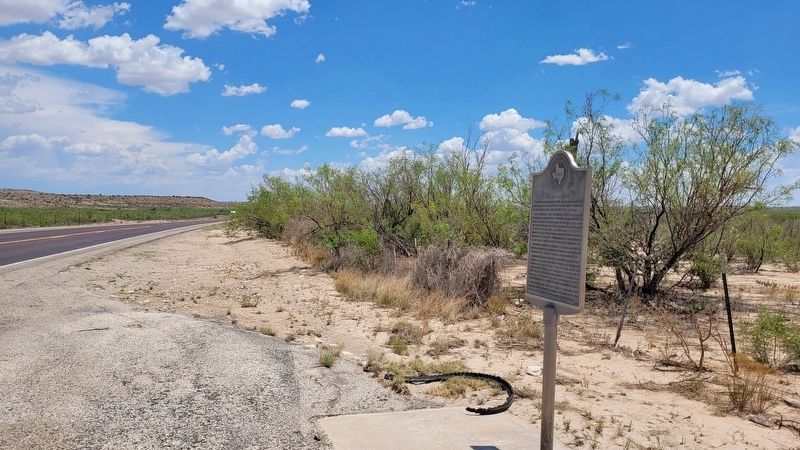 The "Weir No.1" Oil Well Marker at the side of the road image. Click for full size.