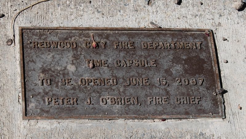 Time capsule plaque behind the flagpole image. Click for full size.