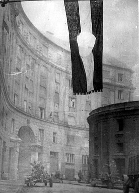 The Hungarian flag with the Communist coat of arms cut out was a revolutionary symbol image. Click for full size.