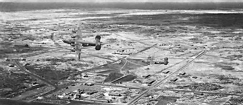 B-24 bombers in flight over the US Army airfield on Baltra, Galpagos Islands image. Click for full size.