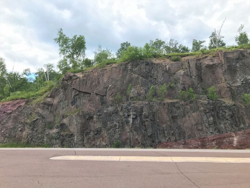 The cliff face across the highway from the marker image. Click for full size.