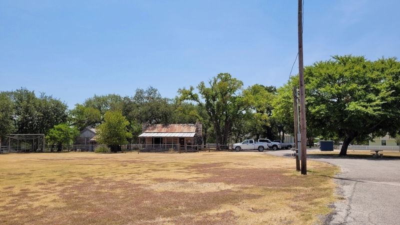 The view of the Boles-Aiken Log Cabin from the Civic Center parking lot image. Click for full size.