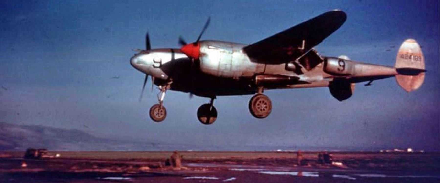 US Army P-38 of 37th Squadron just about to touch down at Triolo, Italy. Click for full size. US Army P-38 of 37th Squadron just about to touch down at Triolo, Italy image. Click for full size.