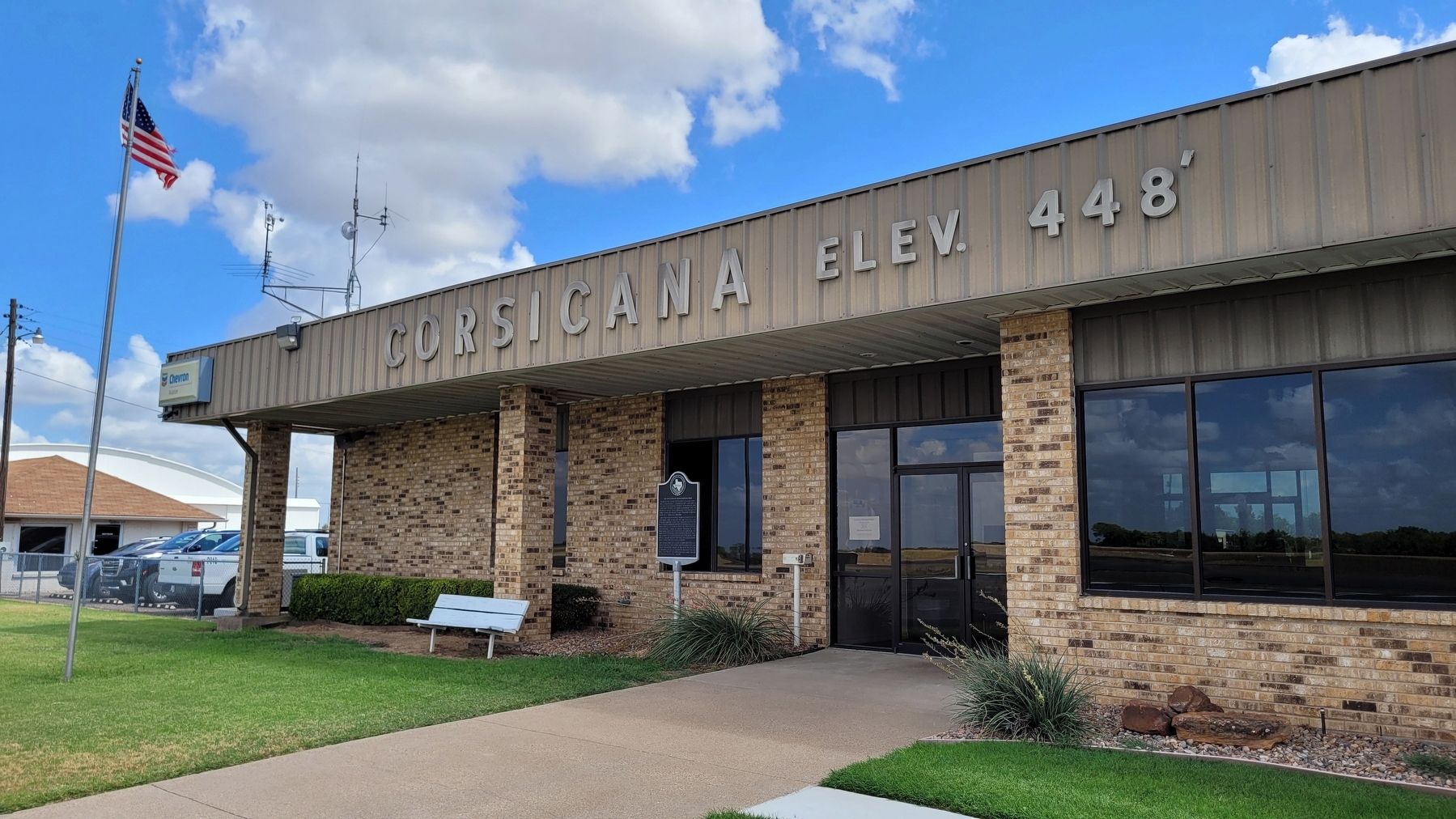 The Air Activities of Texas Corsicana Field Marker in front of the Corsicana Airport Terminal image. Click for full size.
