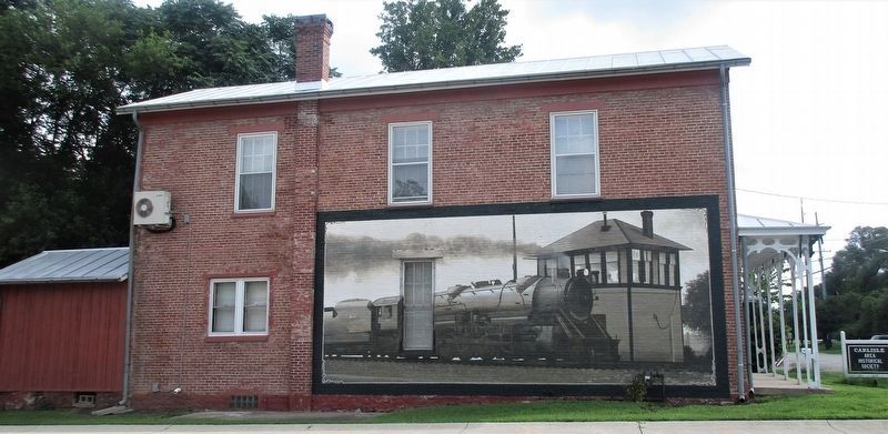 The mural on wall of the Historical Society across from the marker image. Click for full size.