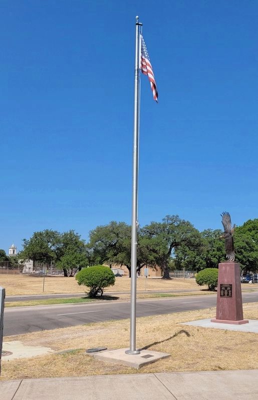 The In Honor and Remembrance Marker is on the ground in front of the US flag image. Click for full size.