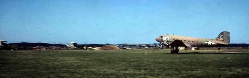 A C-47 Skytrain (serial number 42-100646) of the 313rd Troop Carrier Group, takes off from Nordholz. image. Click for full size.