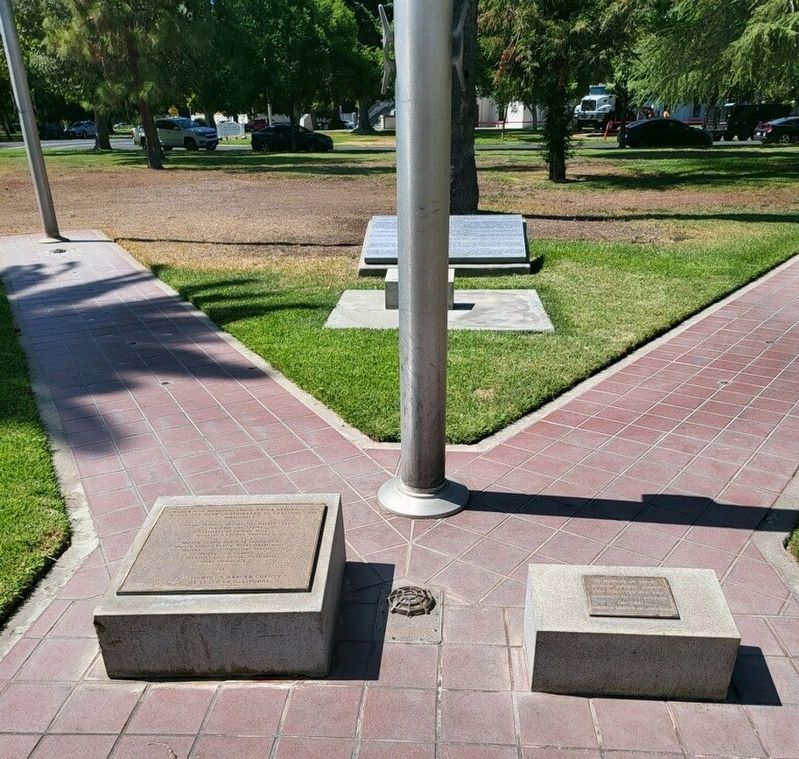 Plaques at the base if the flagpole image. Click for full size.