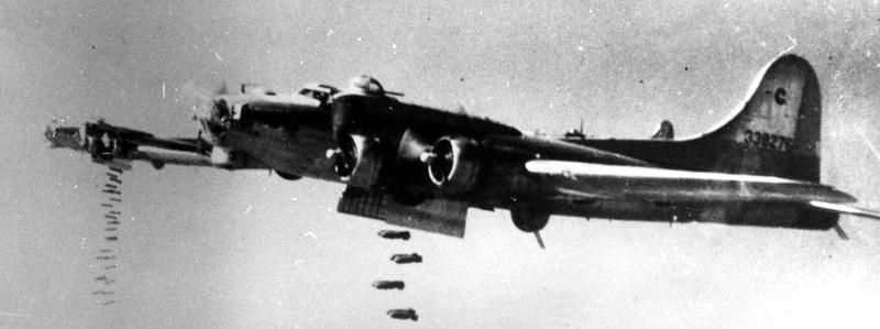 B-17 Flying Fortresses of the 493rd Bomb Group releases bombs over the target. image. Click for full size.