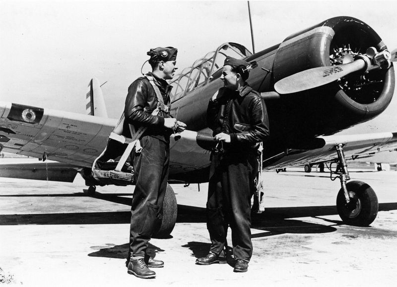 Enlisted Pilot trainees and a BT-13 Basic Trainer image. Click for more information.