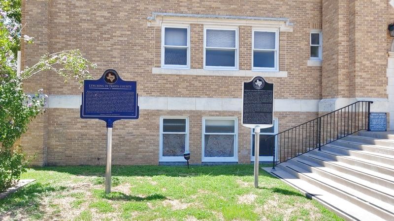 The Lynching in Travis County Marker next to a Texas Historical Commission marker image. Click for full size.