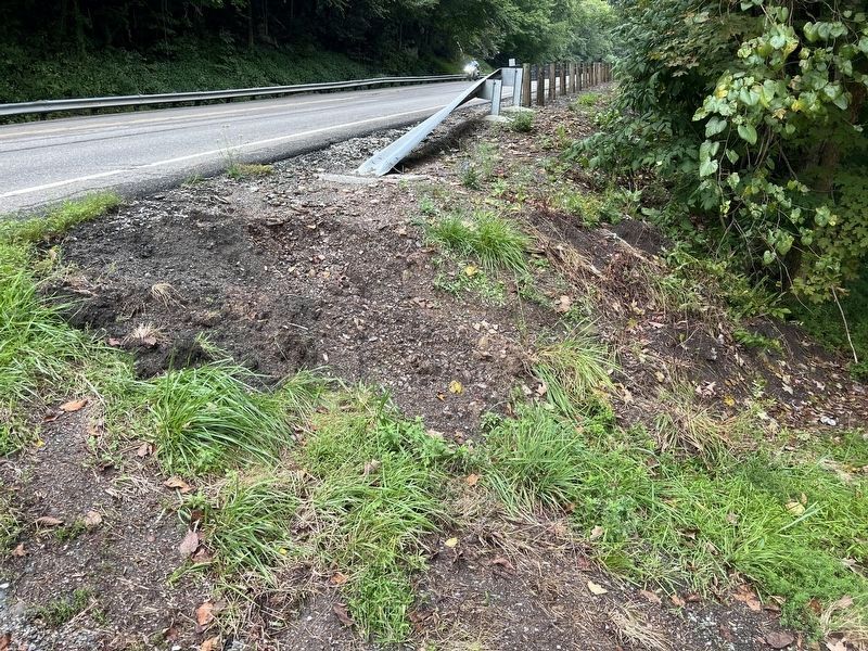 Washed out section of the road where the marker once stood. Click for full size. Washed out section of the road where the marker once stood image. Click for full size.