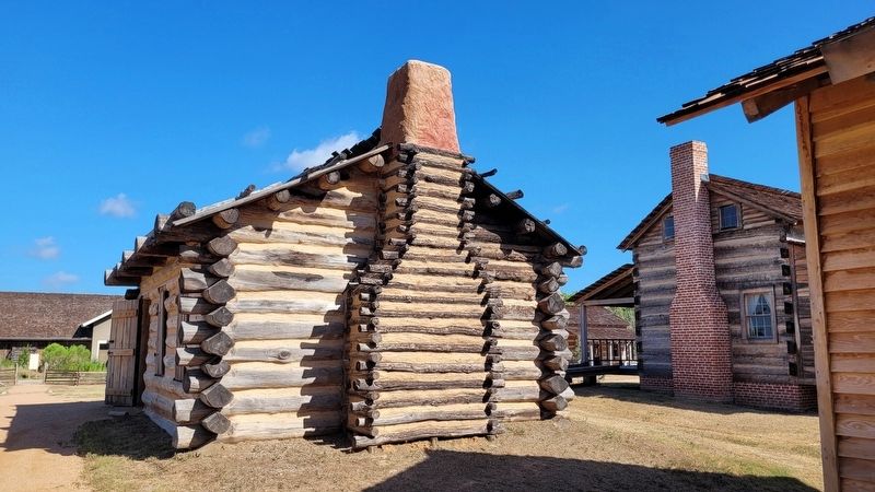 Reproduction Cabin on east side of visitors center image. Click for full size.