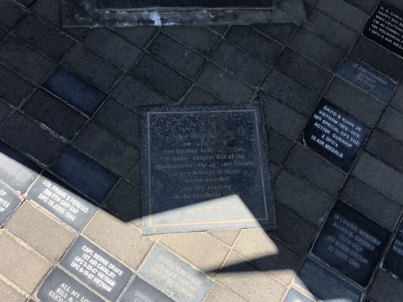 Plaque at base of memorial image. Click for full size.