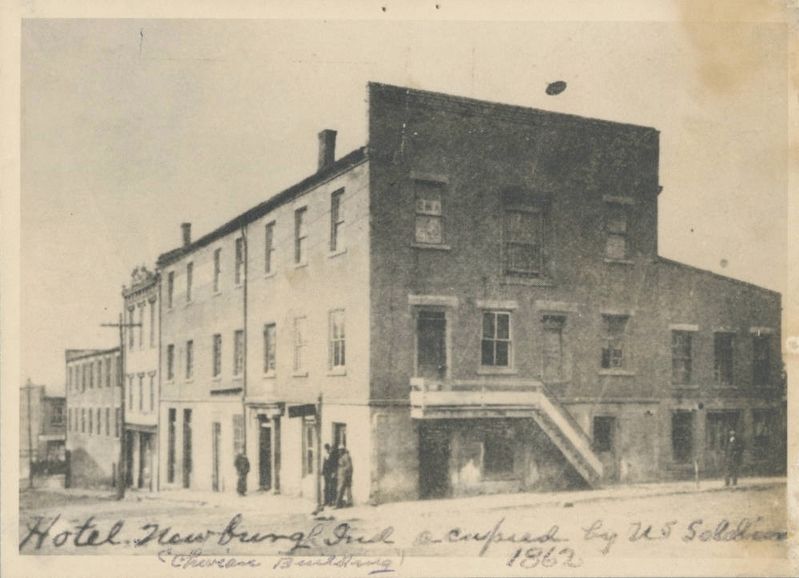 Union soldiers occupy the Exchange Hotel image. Click for full size.