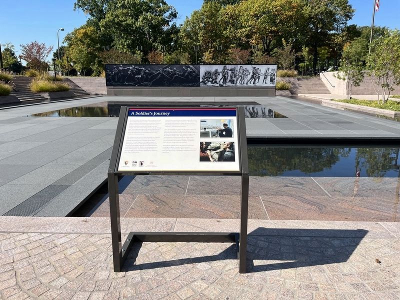 A Soldier�s Journey Marker with the artwork progressing in the background as of 2022 image. Click for full size.