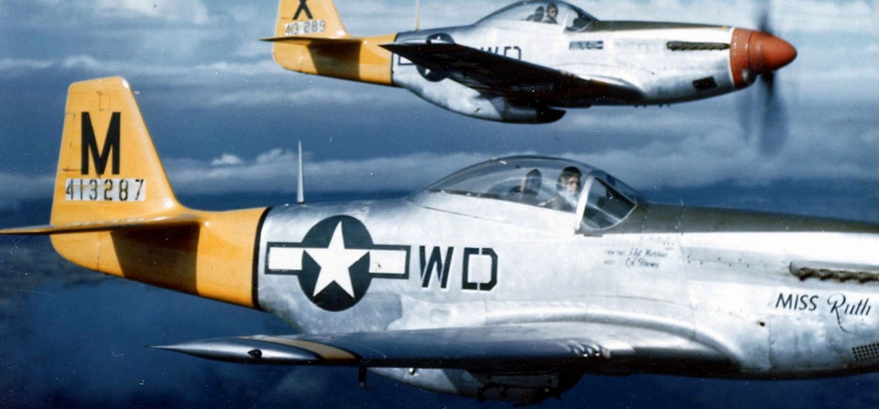 P-51D Mustangs of the 4th Fighter Squadron in flight, Italy, 1944.. Click for full size. P-51D Mustangs of the 4th Fighter Squadron in flight, Italy, 1944. image. Click for full size.