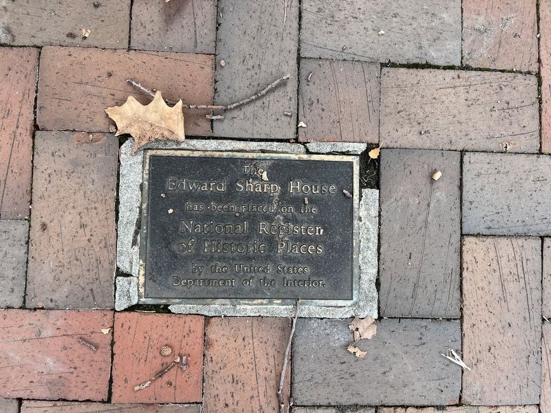 National Register of Historic Places plaque has been placed in the sidewalk in front of the house image. Click for full size.