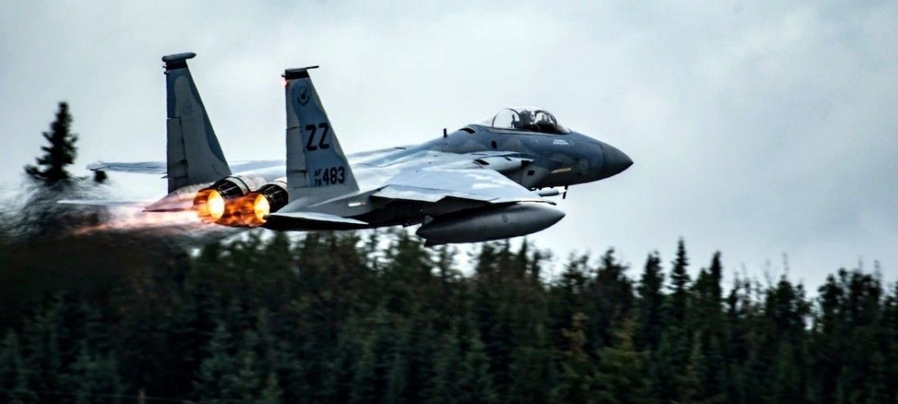 An F-15C Eagle takes off from the flightline at Eielson Air Force Base image. Click for more information.