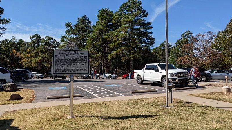 Reverse side of the marker with the Visitor Center parking lot in the background image. Click for full size.