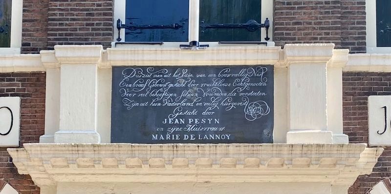 Jean Pesjin Almshouse Marker - dedication plaque above the door image. Click for full size.