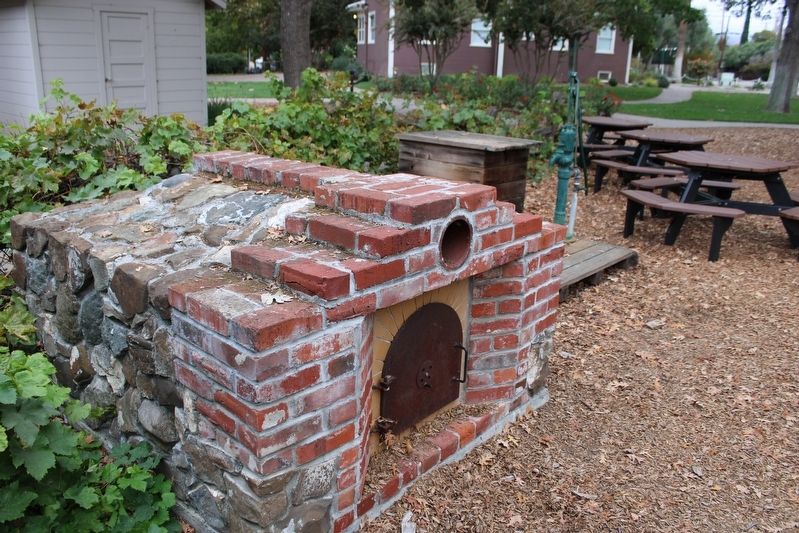 Outdoor Red Brick Oven & Water Pump image. Click for full size.