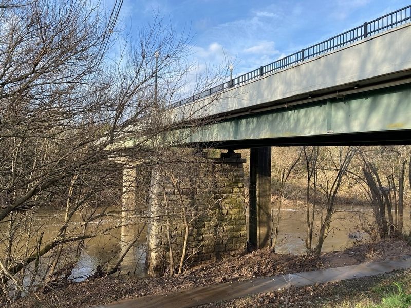 The underside of the current bridge showing the old bridge support. image. Click for full size.